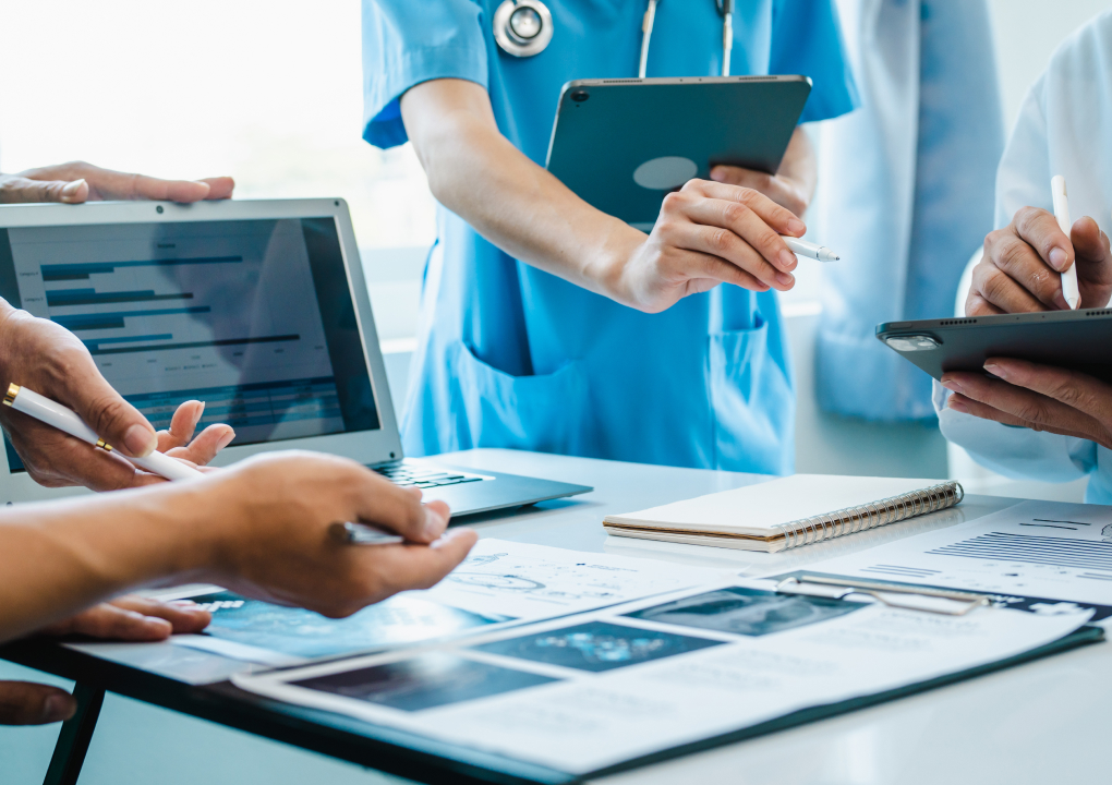 Healthcare workers discussing data