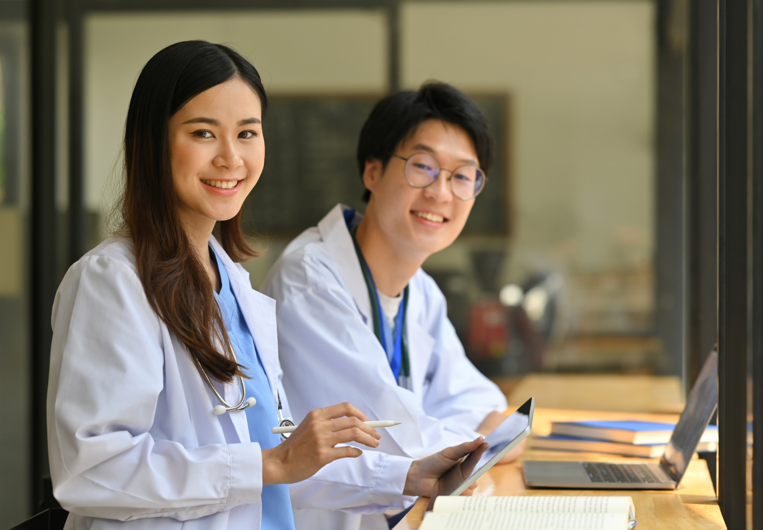 Helpful healthcare staff smiling and working